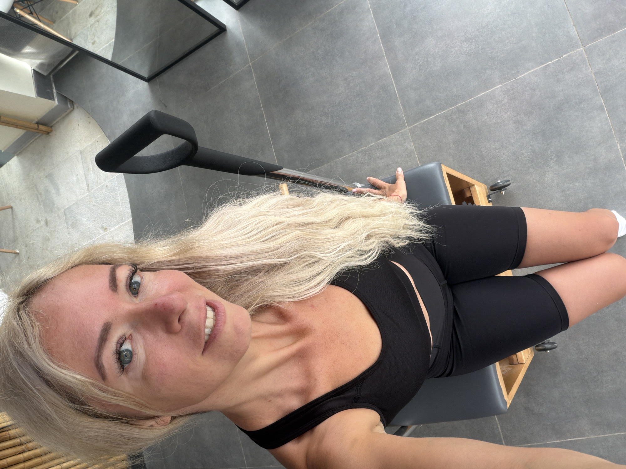 Pilates studio selfies with a Da Lat cityscape backdrop
