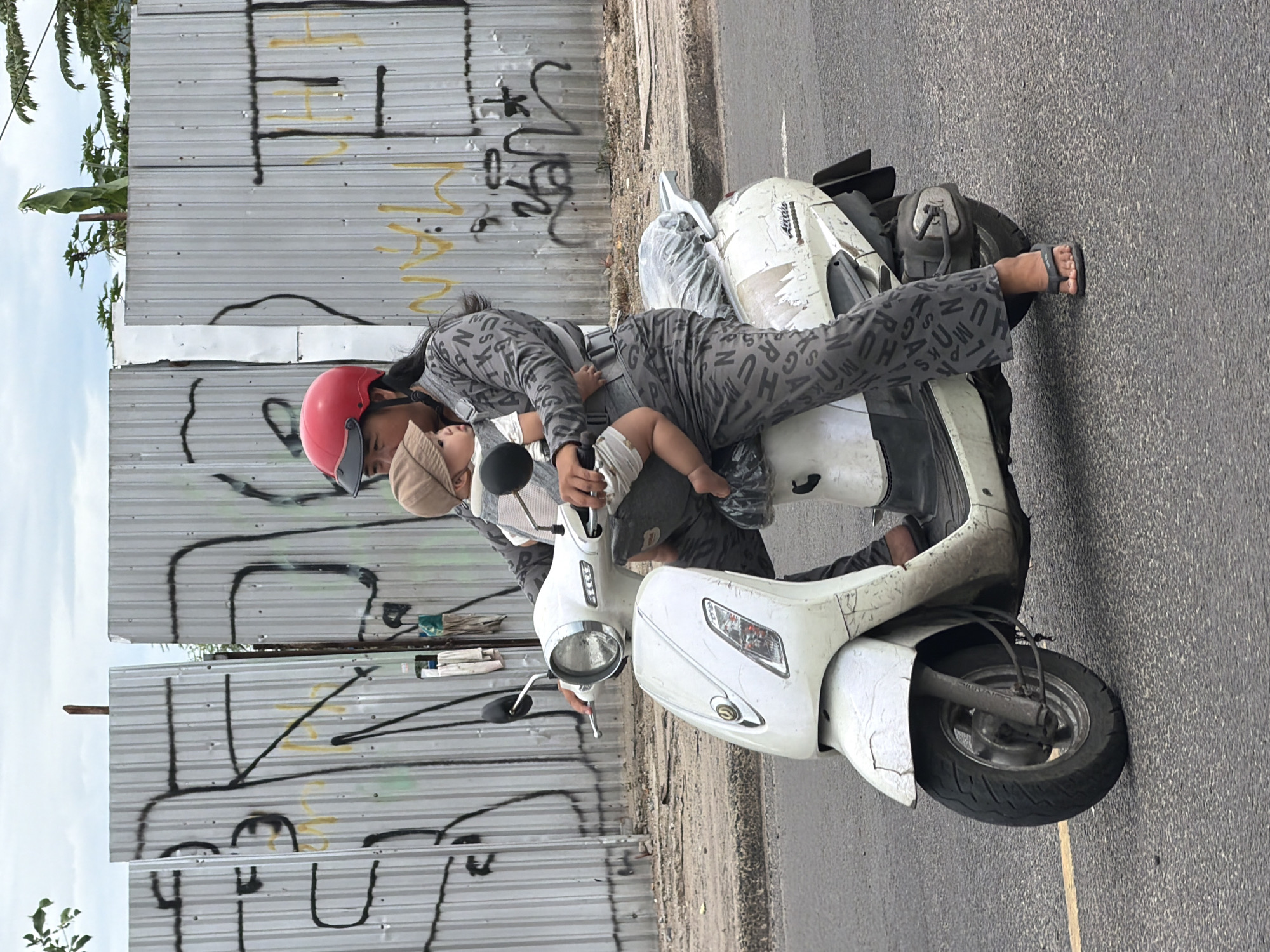 Scooter traffic flows through a Nha Trang street