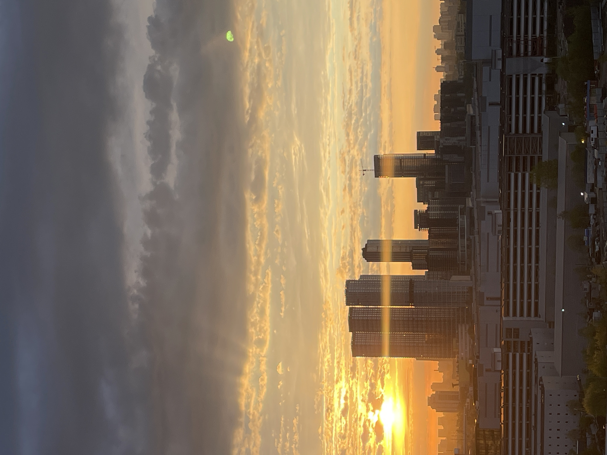 Golden sunset observed over city skyline