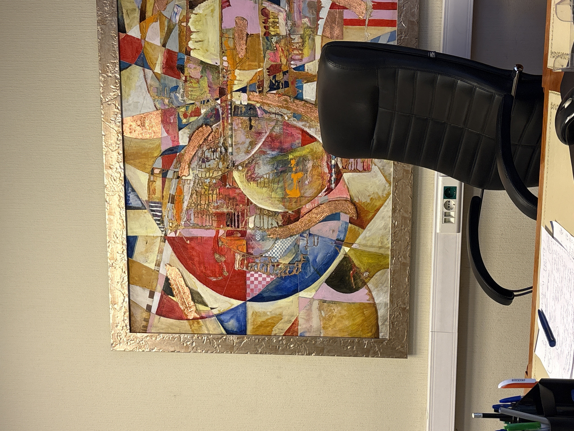 Moscow workspace interior documented with printer and abstract art