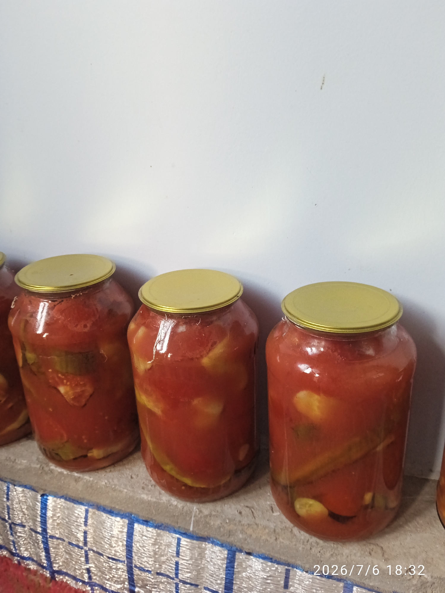 Homemade tomato preserves jarred up in Kurganabad
