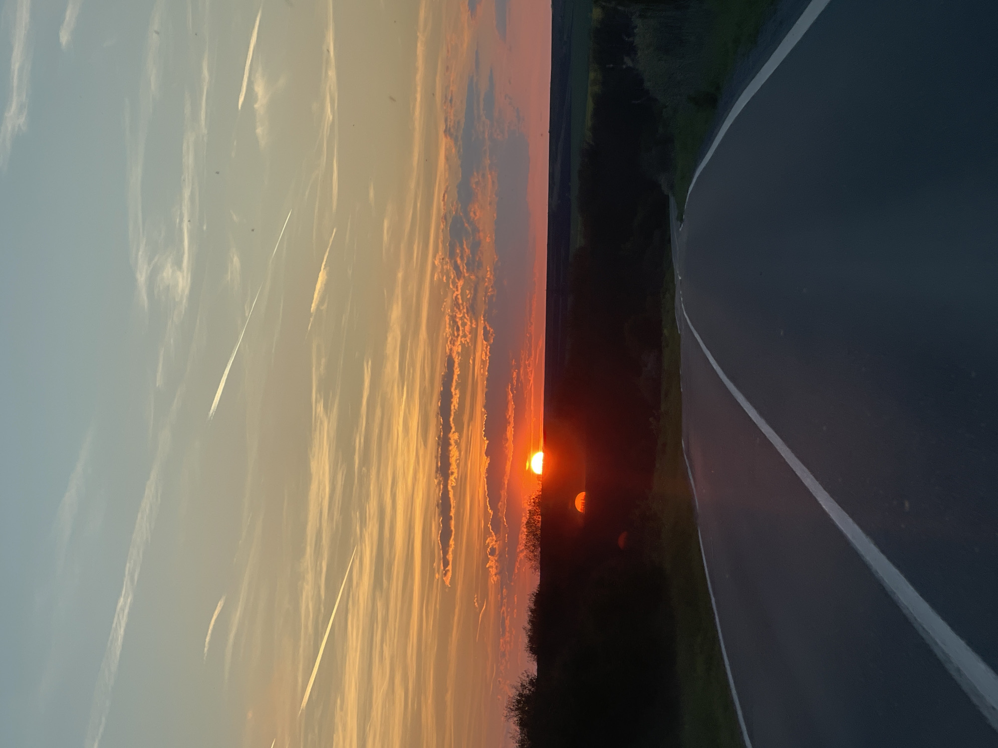 Sunset observed along curved road in Burgas, Bulgaria
