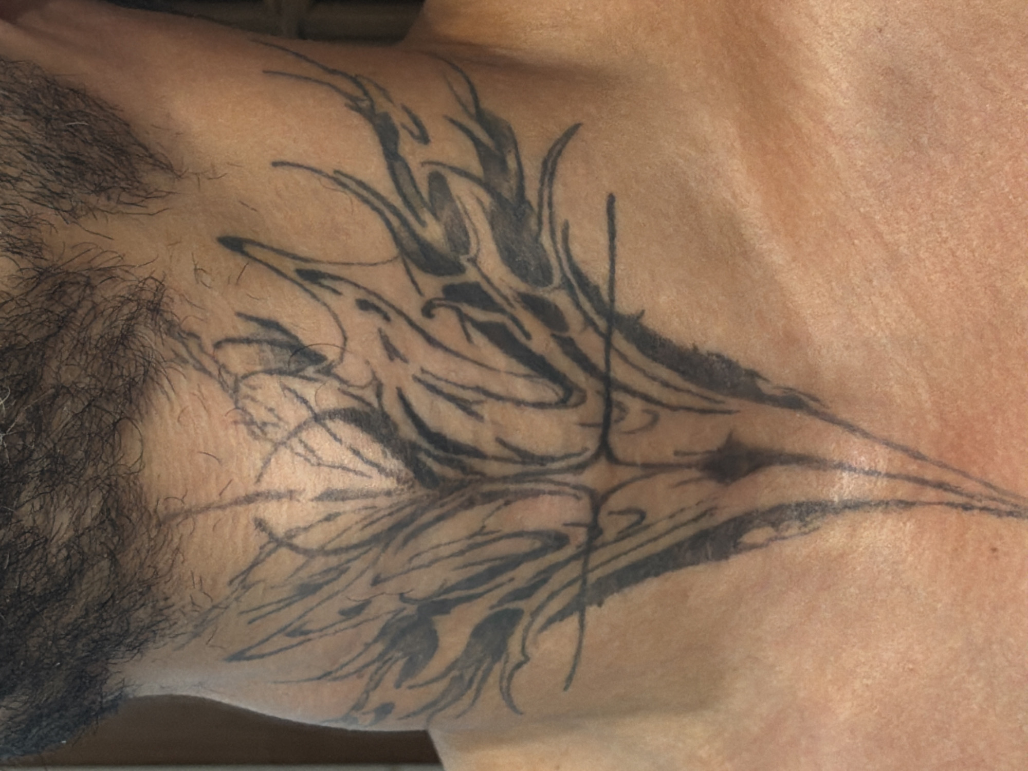 Detailed tattoo shots in Milan: neck piece and butterfly hand ink