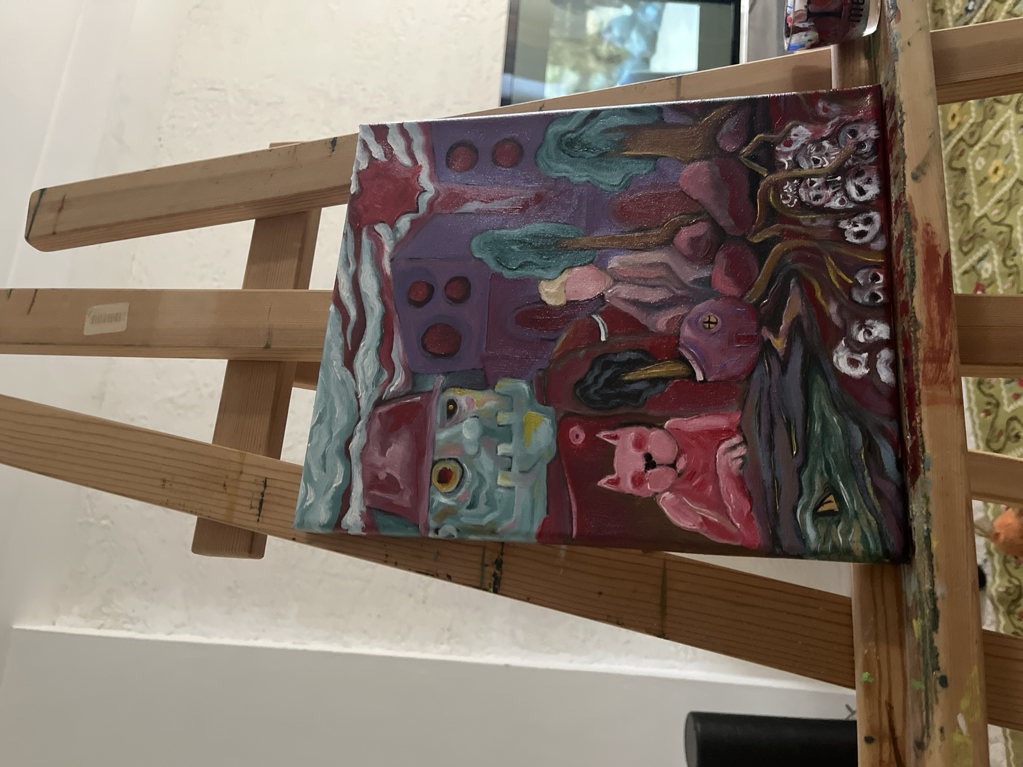 Abstract painting with blue figure, pink cat observed on easel