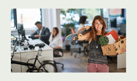 A Female Employee Packs Her Belongings To Relocate