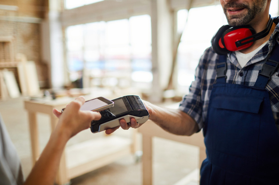 Employee paying with an expense card for employees at the counter