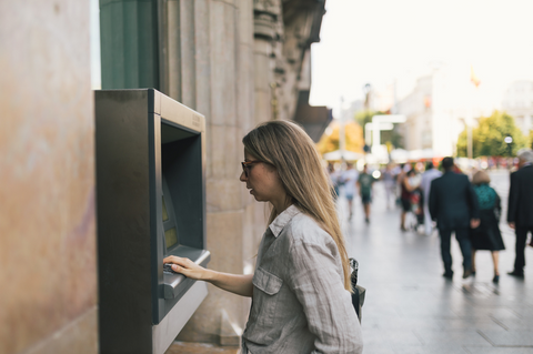 Employee learning about Safeguarding business funds, while using a corporate card at an ATM