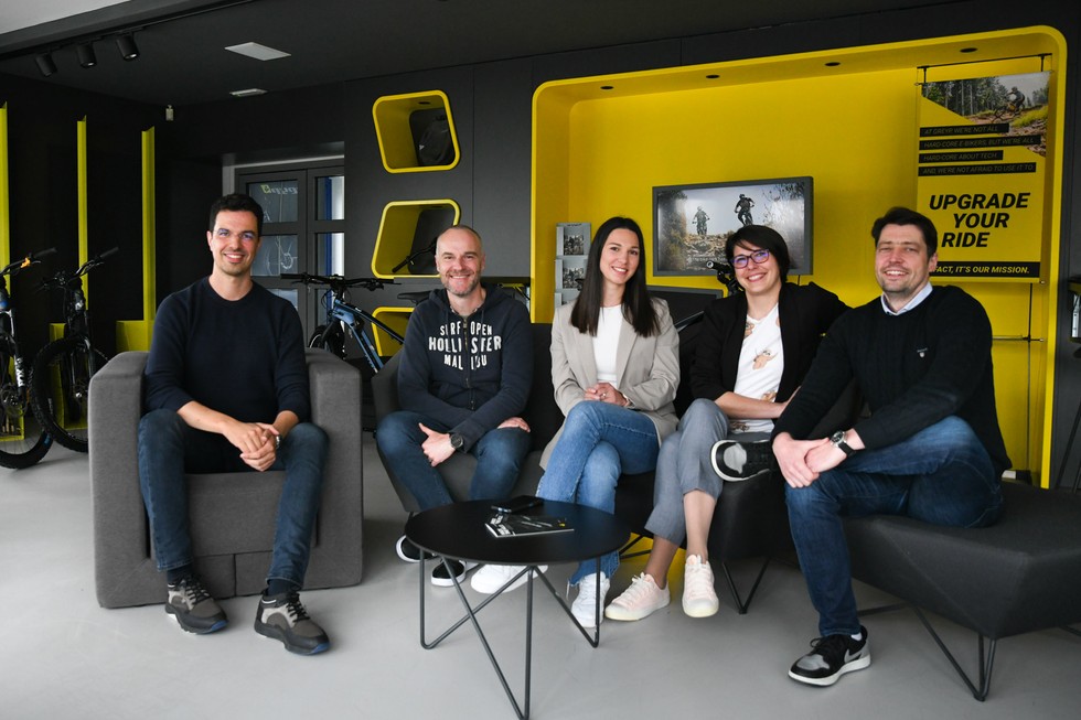 Porsche e-bikes team sitting in their office