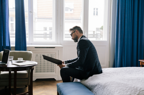 A man reading our guide to employee reimbursements