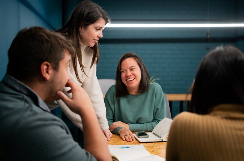 Employees discussing international bank payments glossary