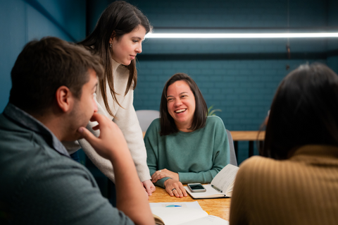 Employees discussing international bank payments glossary