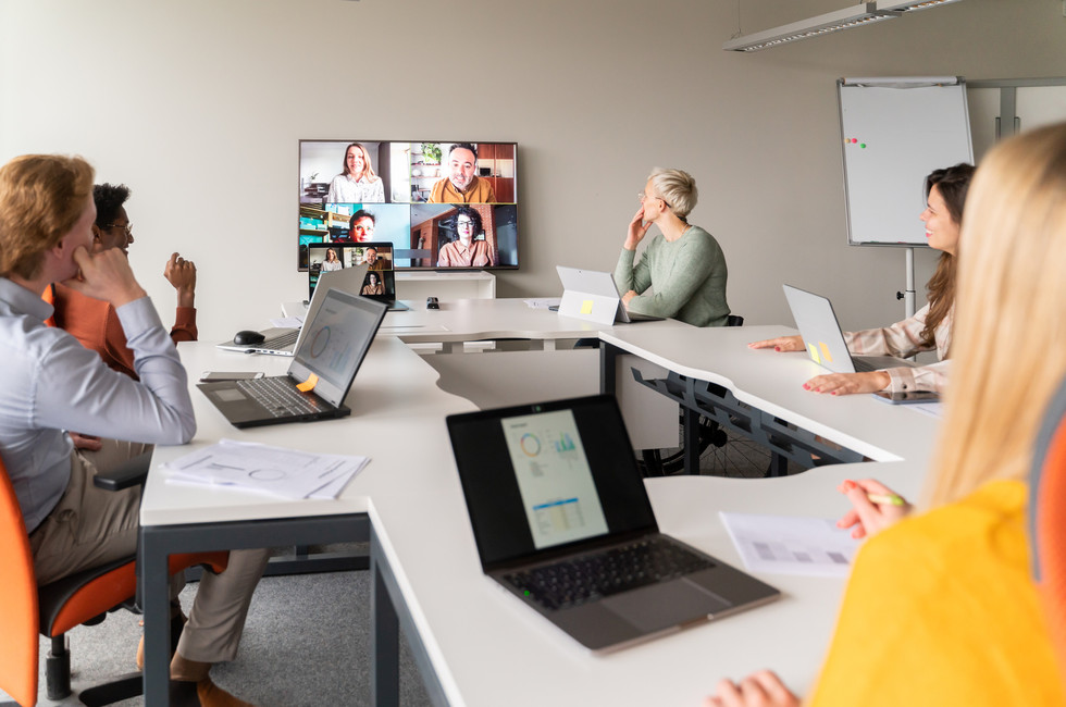 Photo showing international multi-entity team in a meeting