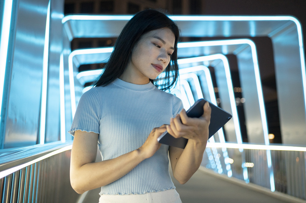 Image of modern finance leader using AI on a tablet