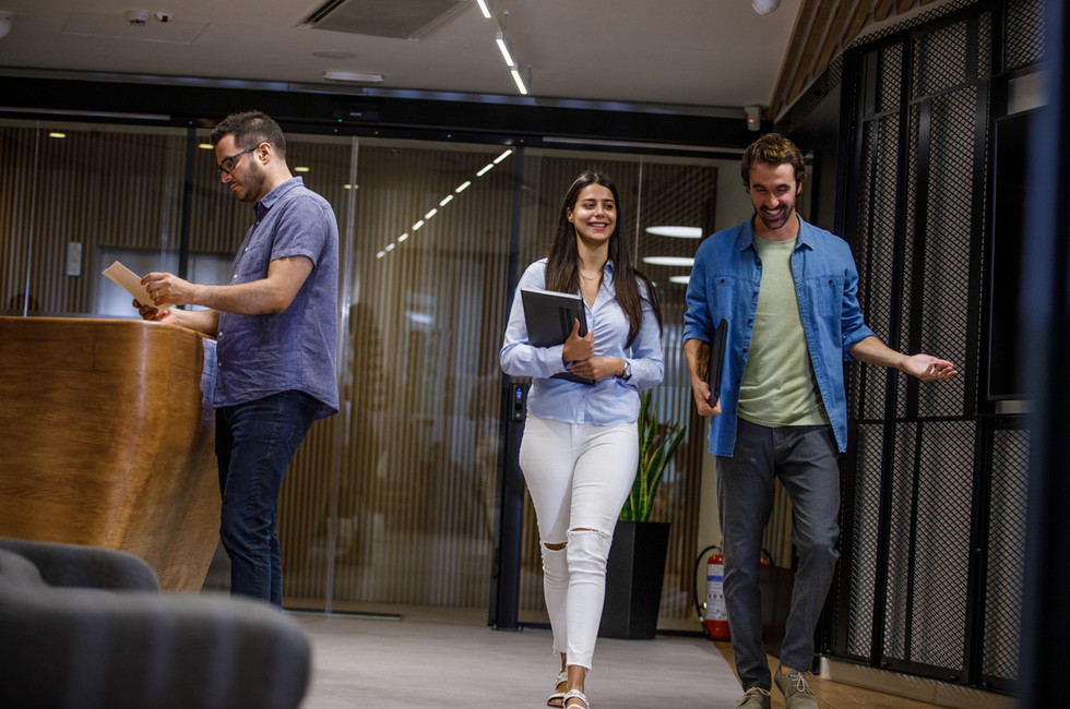 coworkers collaborating while AI back office supports finance