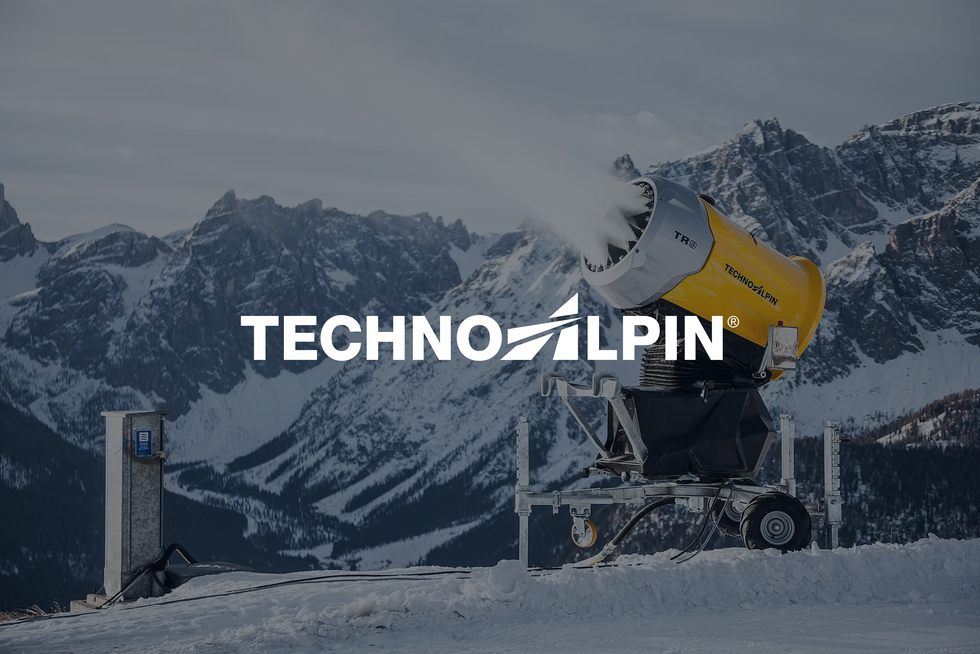 TechnoAlpin snow-making equipment on a mountainside, with the TechnoAlpin logo