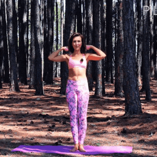 Lisa from Pilates by Lisa performs a Pilates exercise in nature, wearing yoga pants and a sports bra.
