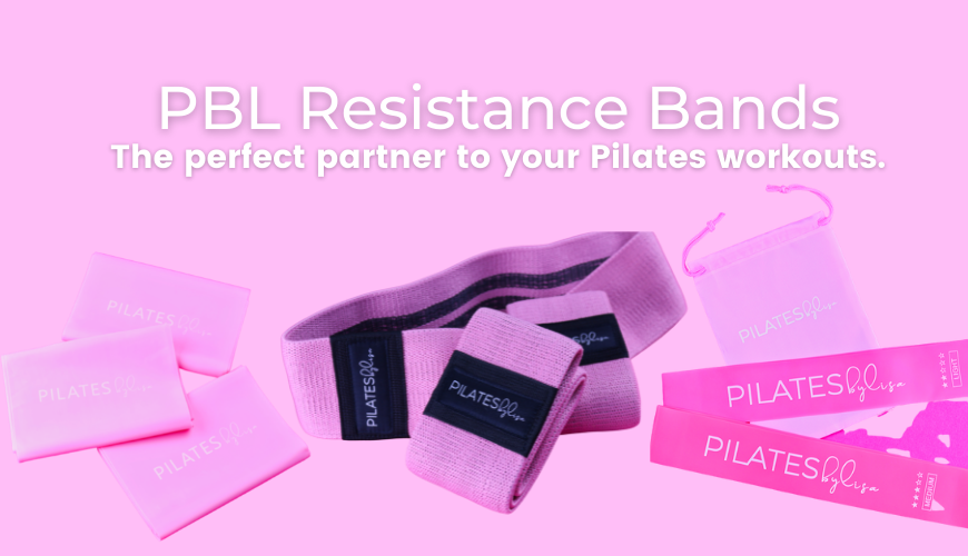 Lisa demonstrates a Pilates exercise wearing pink and purple activewear, possibly using a strap or belt, in a studio or outdoor setting.