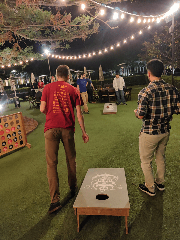 Speakers Playing Corn Hole