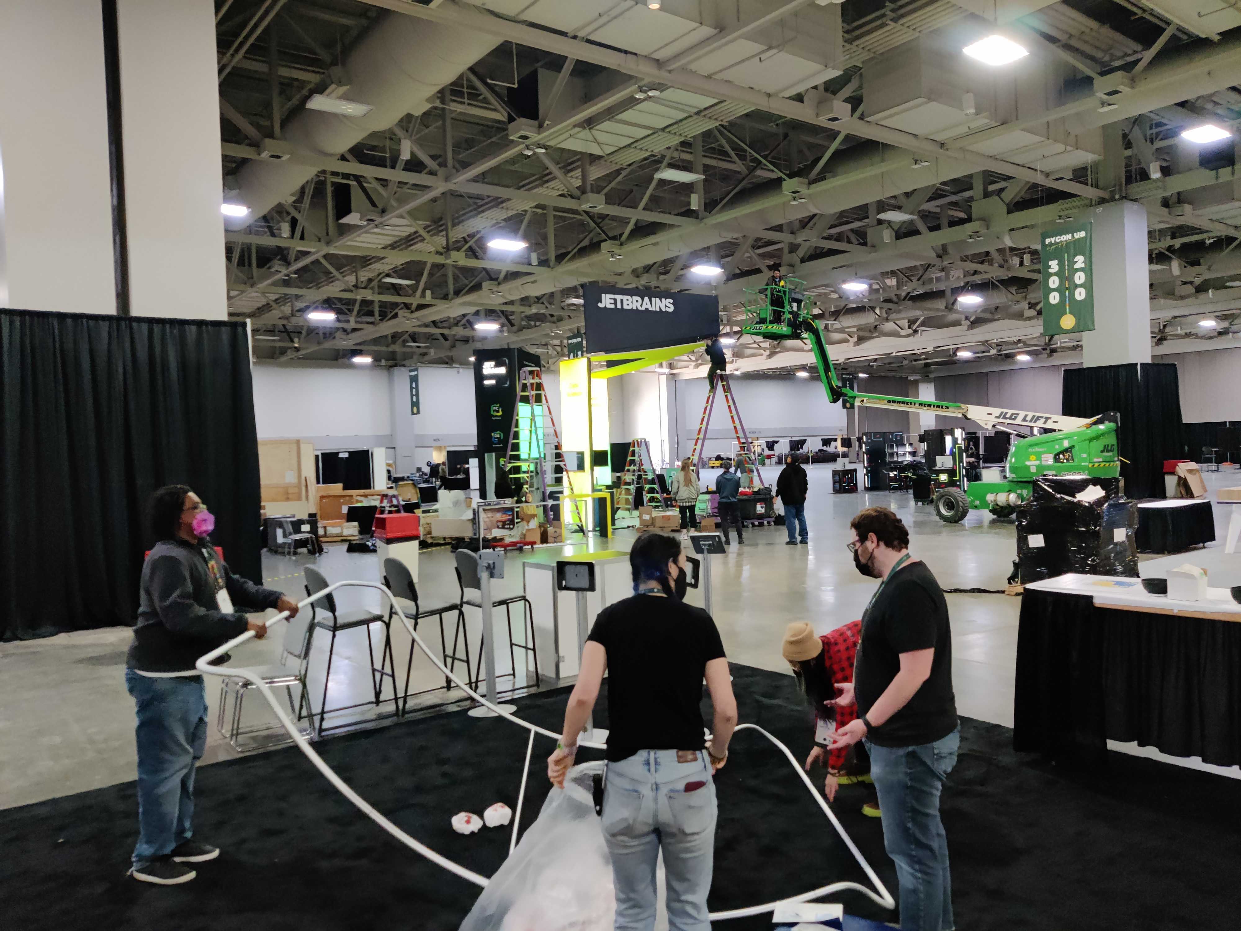 Booth prep - volunteers help setup the PSF booth in the expo hall