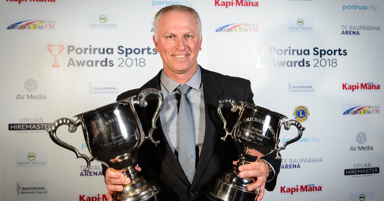 Nigel Hillier with his son Daniel's trophies from the 2018 Porirua Sports Awards