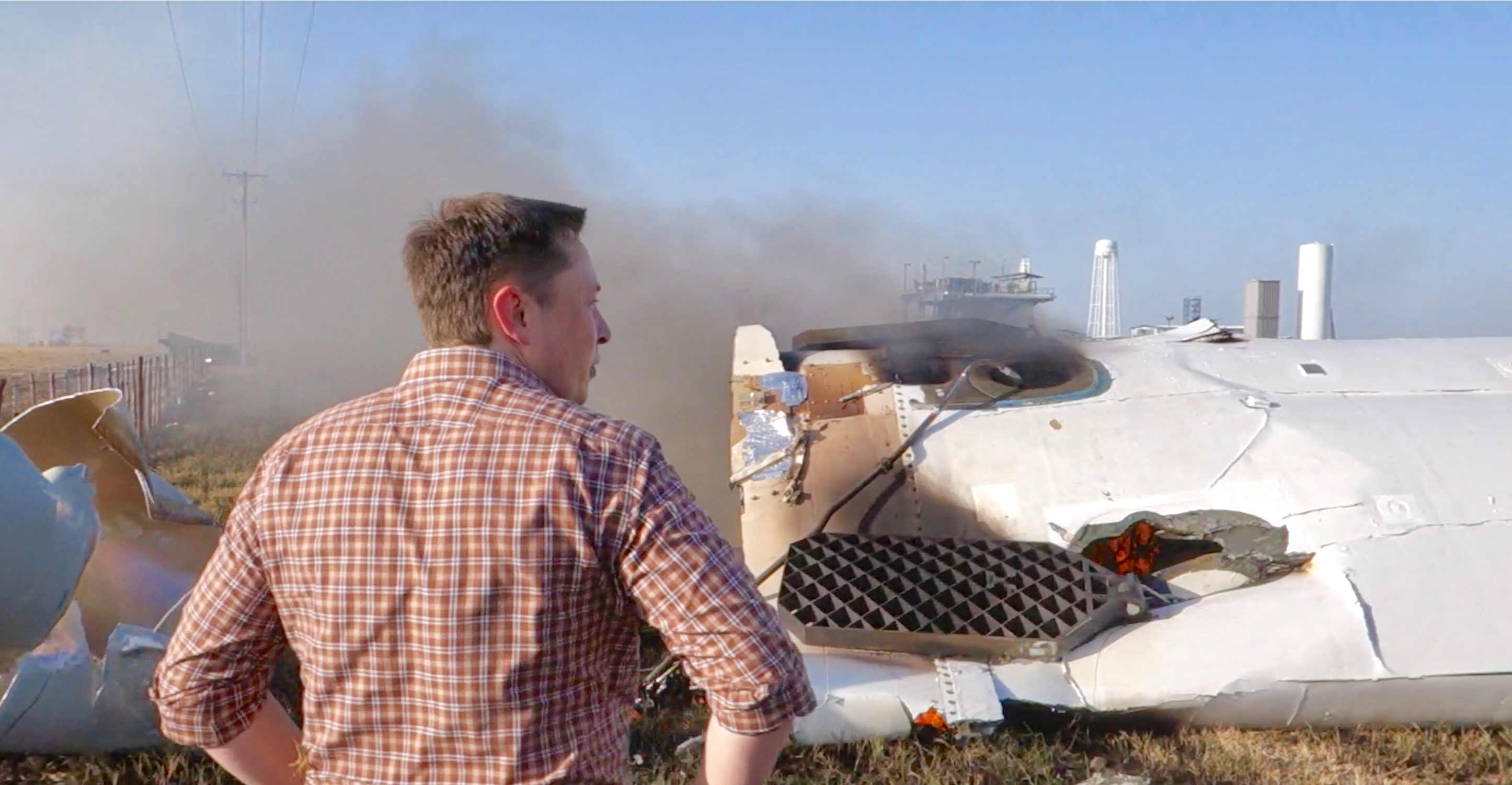 By Steve Jurvetson from Menlo Park, USA - Elon Musk overlooking the remains of F9R, CC BY 2.0, Link