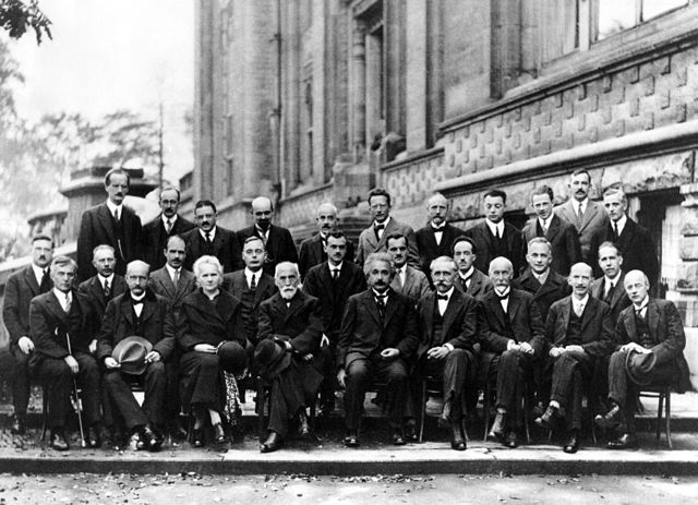 Solvay conference 1927" by Benjamin Couprie - http://w3.pppl.gov/. Licensed under Public domain via Wikimedia Commons.