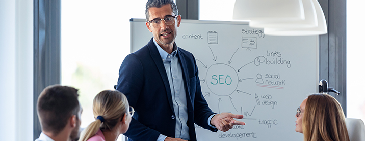 Man presenting SEO plan for his company's new website