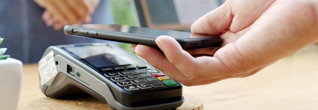 Close up of contactless payment with mobile phone