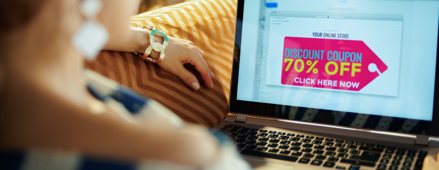 Woman lounging on her couch browsing eCommerce sales