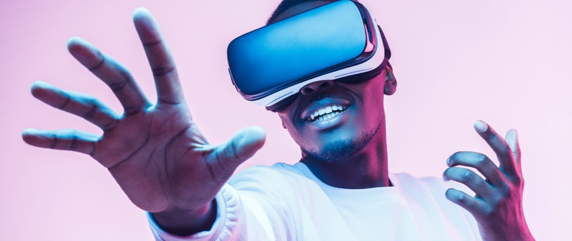 Young black man using Virtual Reality headset