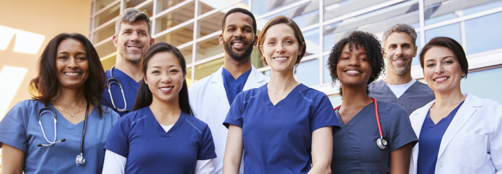 Team of happy doctors and nurses