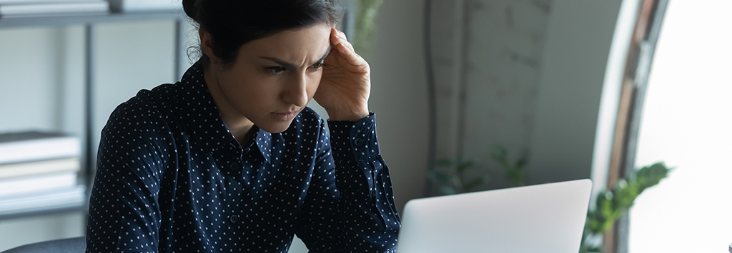 Young woman frustrated while browsing eCommerce website