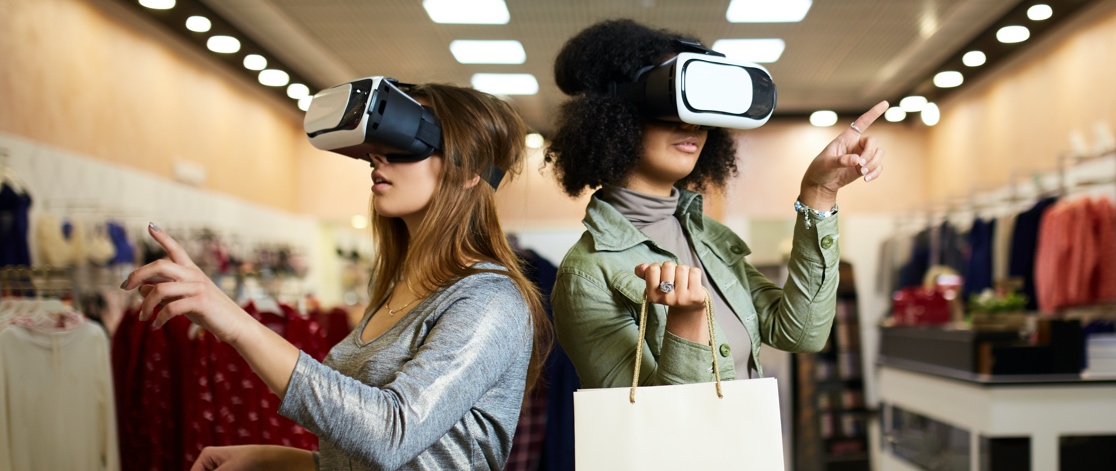 Two women shopping with virtual reality headsets on