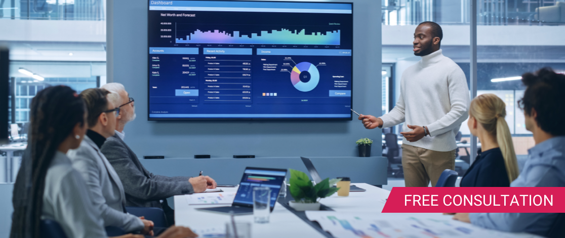 Young black man standing up and giving a presentation on marketing data to his peers