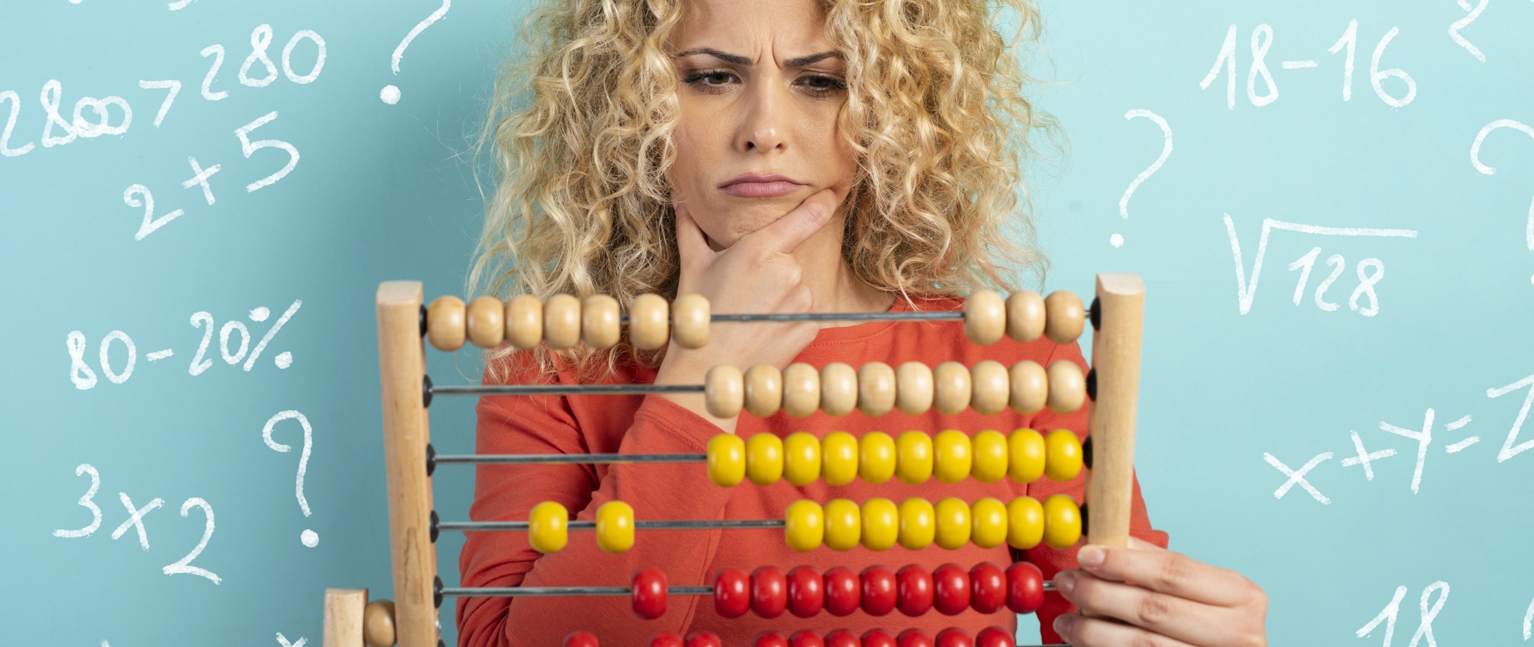 Confused young woman holding an abacus and scratching her chin Confused young woman holding an abacus and scratching her chin