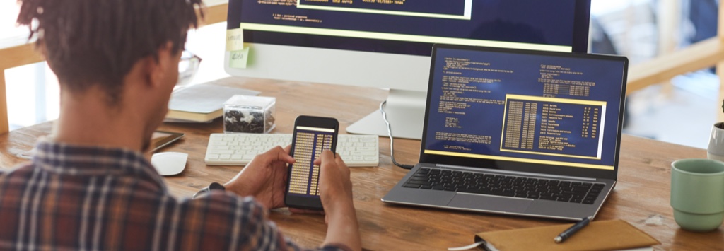 Mobile application developer writing code