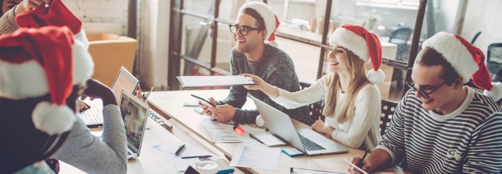 eCommerce team wearing Santa hats in office