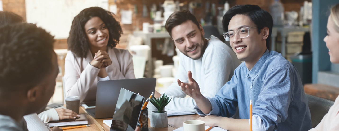 Group of young professionals having a discussion in their office