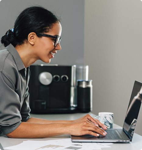 Young woman checking her email on a laptop