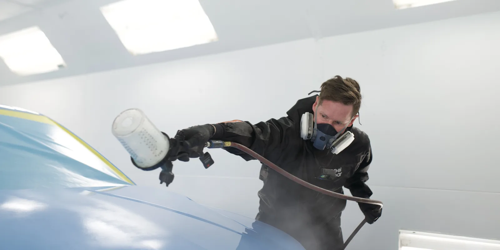 Peelclear-finished vehicle with a true automotive paint surface