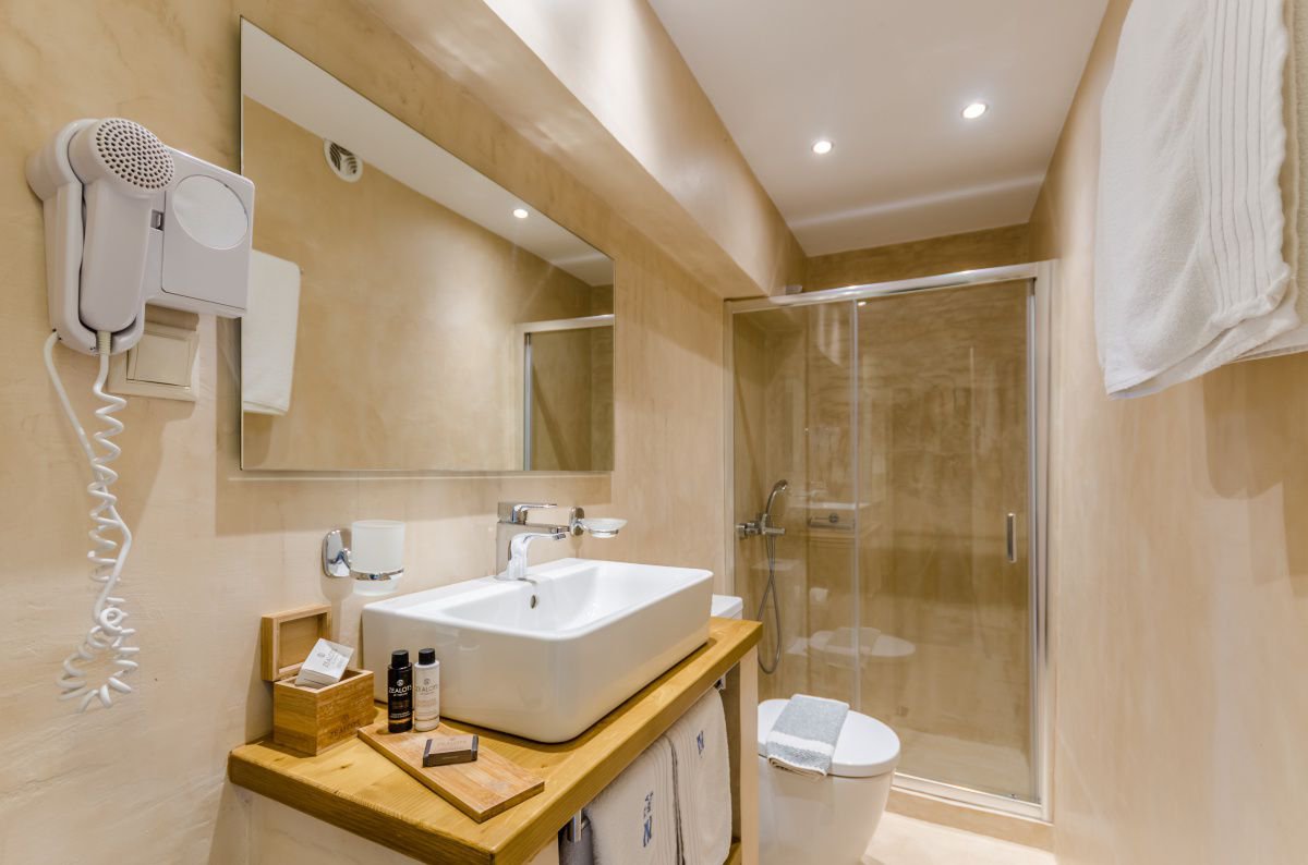 The bathroom of Economy Twin Room at Pela Mare Hotel