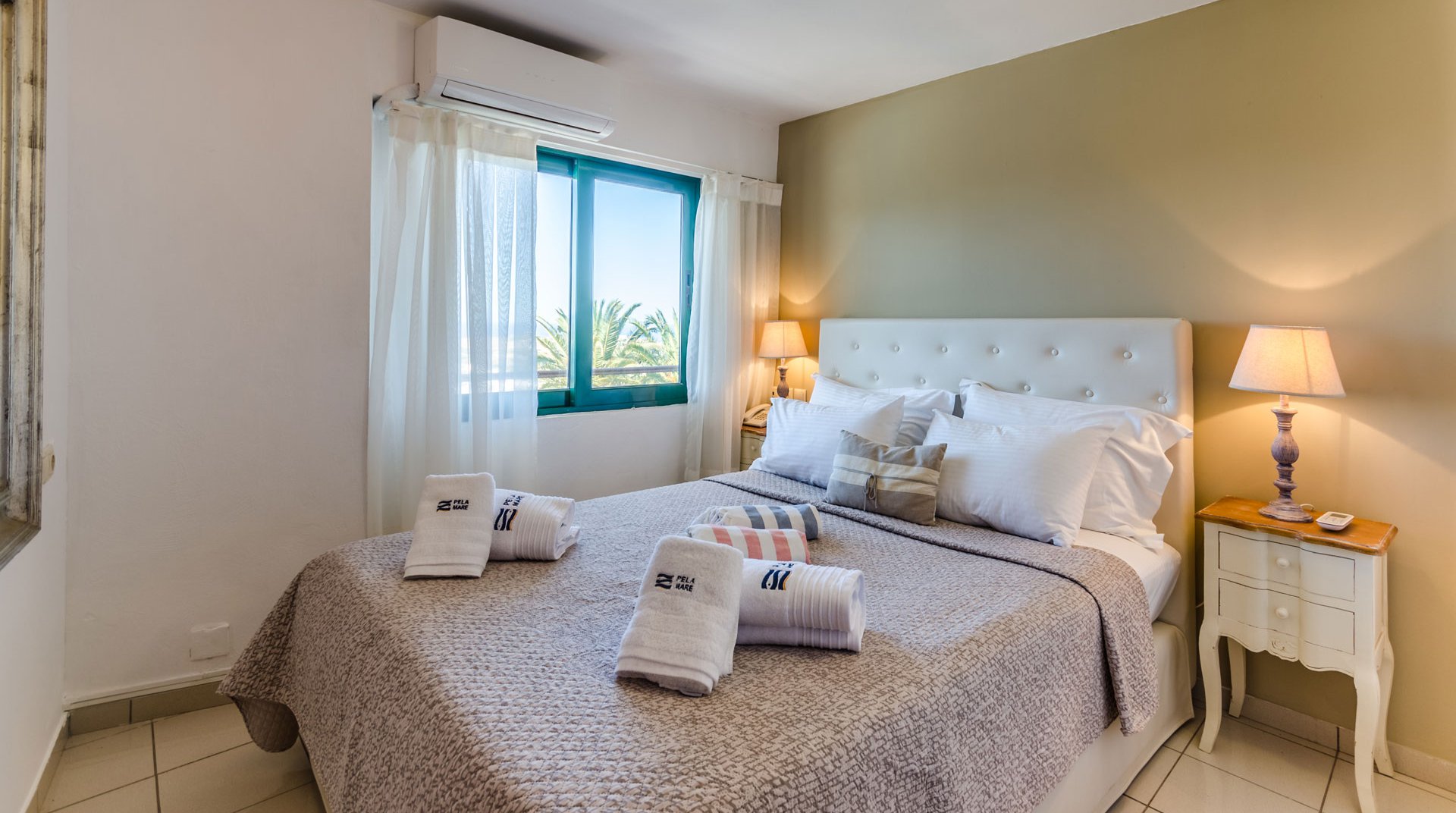 The bedroom of Deluxe Suite at Pela Mare Hotel