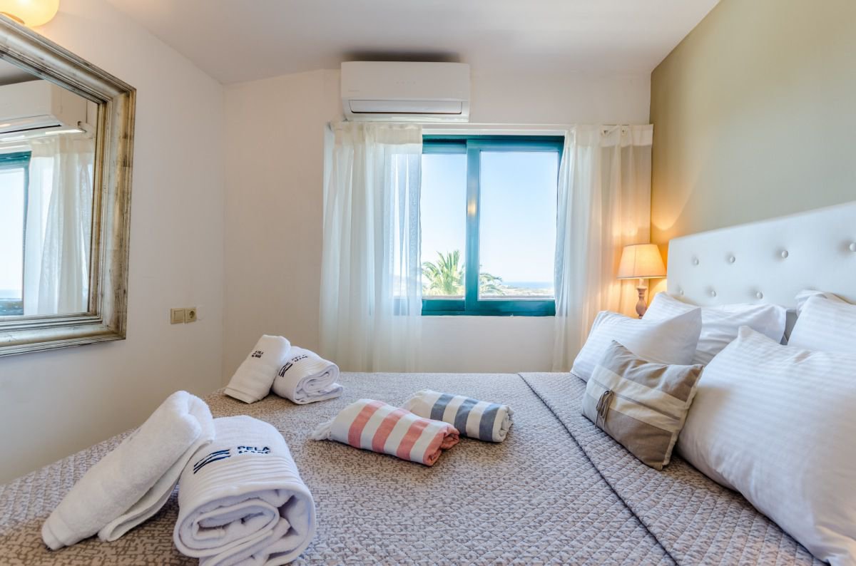 The bedroom of Deluxe Suite at Pela Mare Hotel