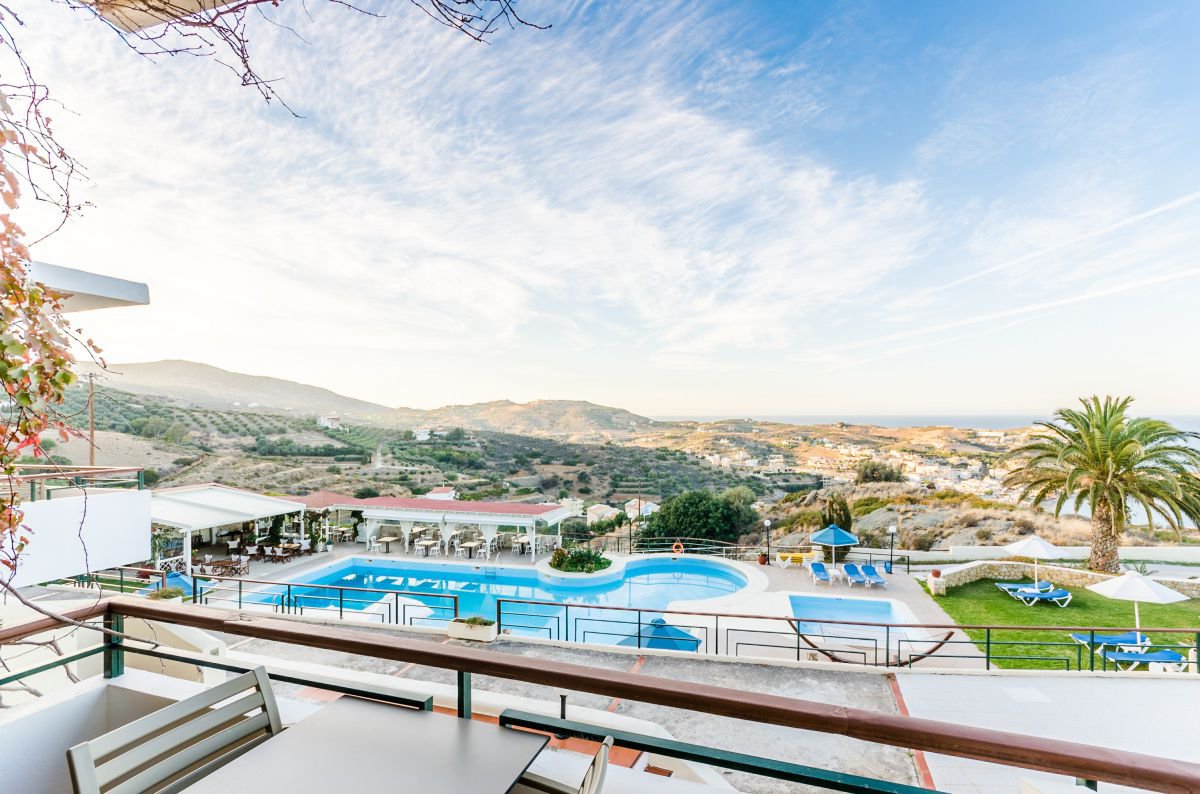 The view to the swimming pool of the Family room at Pela Mare Hotel