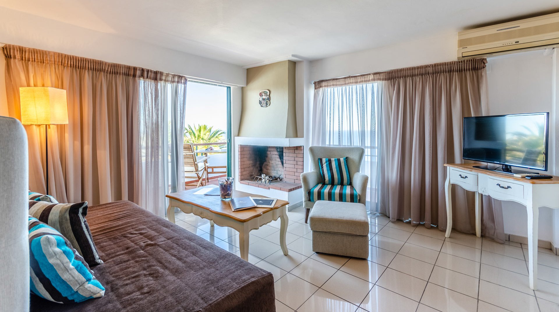 The living room of Deluxe Suite at Pela Mare Hotel