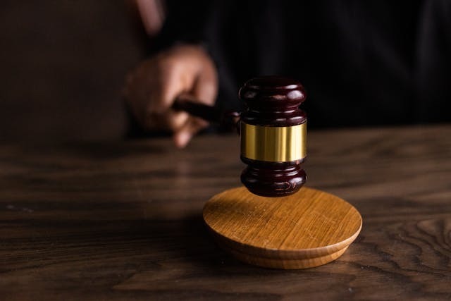 Wooden gavel on a wooden table