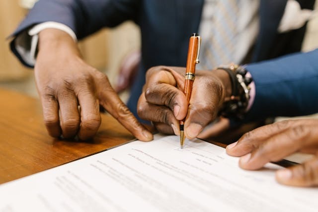 A man signing a document