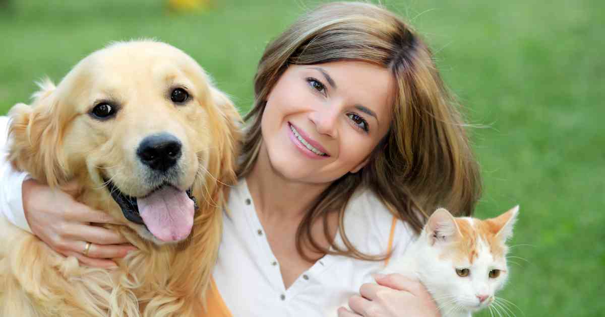 happy-person-with-their-dog-and-cat