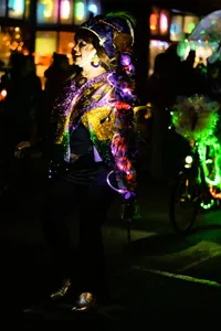 Photograph: Illuminated Reveler at Night