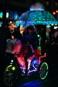 Photograph: Illuminated Tricycle Parade Rider